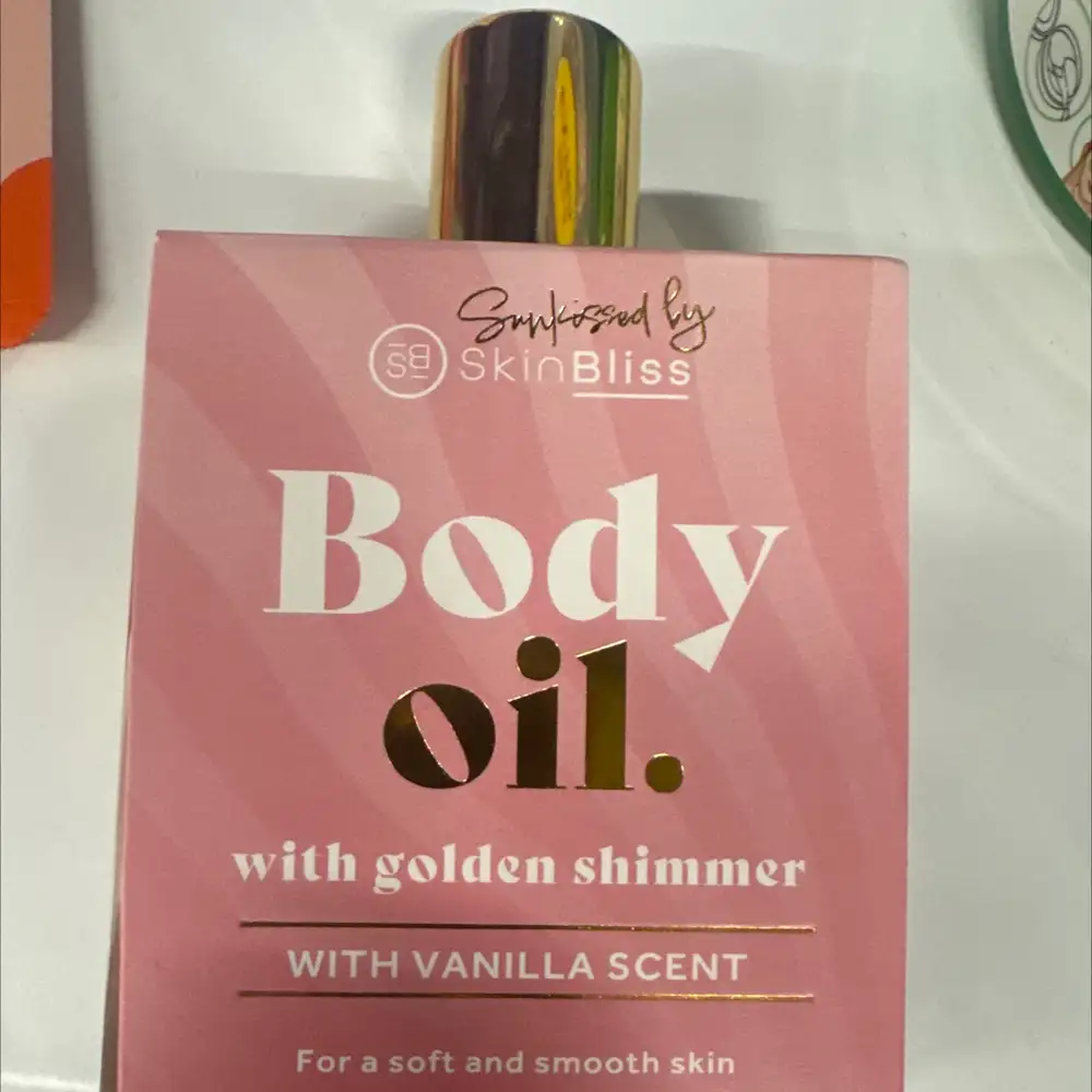 SKINBLISS - Body oil with golden shimmer, vanilla scent