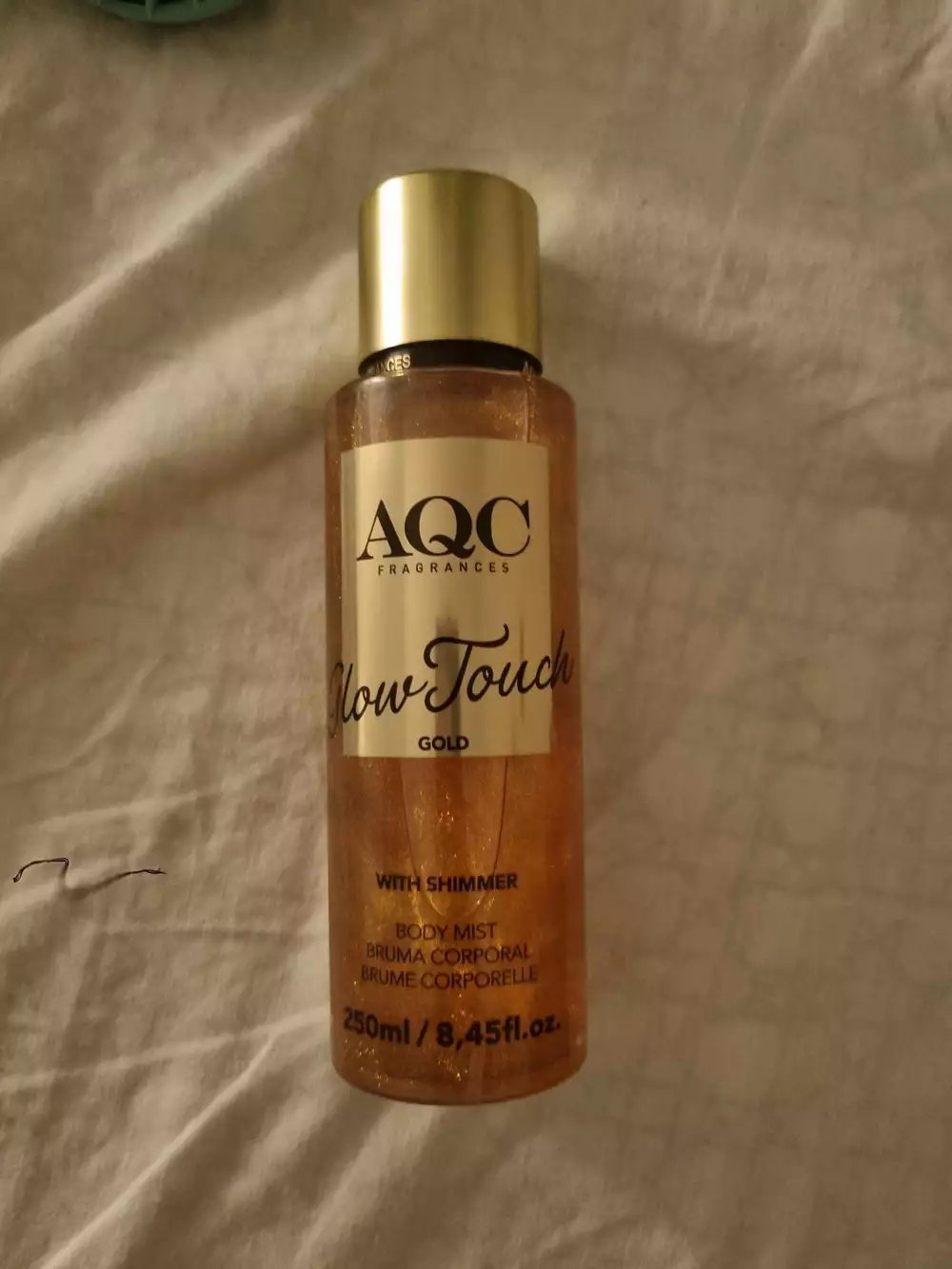 AQC FRAGRANCE - Glow touch gold - Body mist with shimmer
